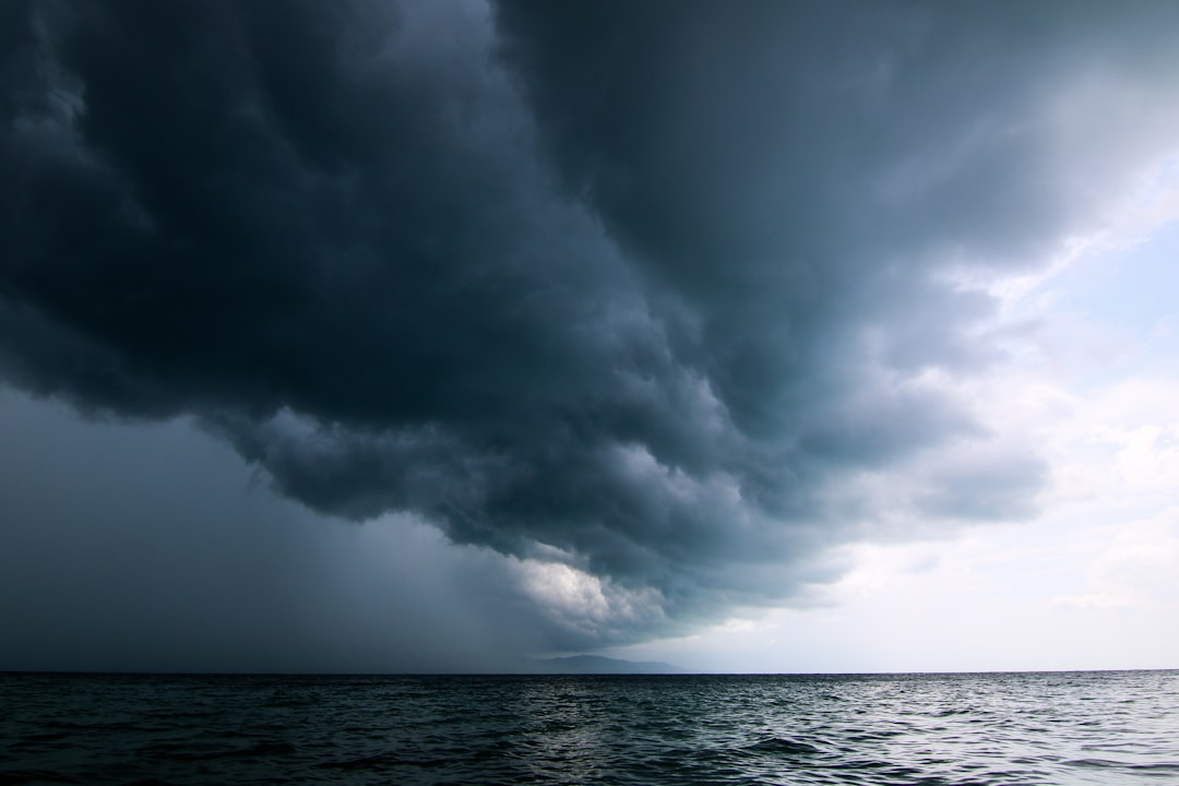 Storm clouds moving over open water