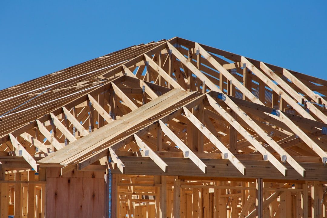 A single family home under construction with exposed wood framing