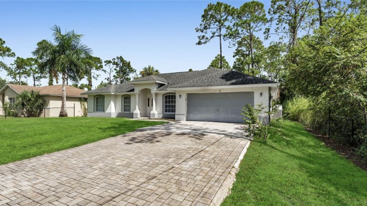Home on acreage east of Collier Boulevard served by a private well and septic system
